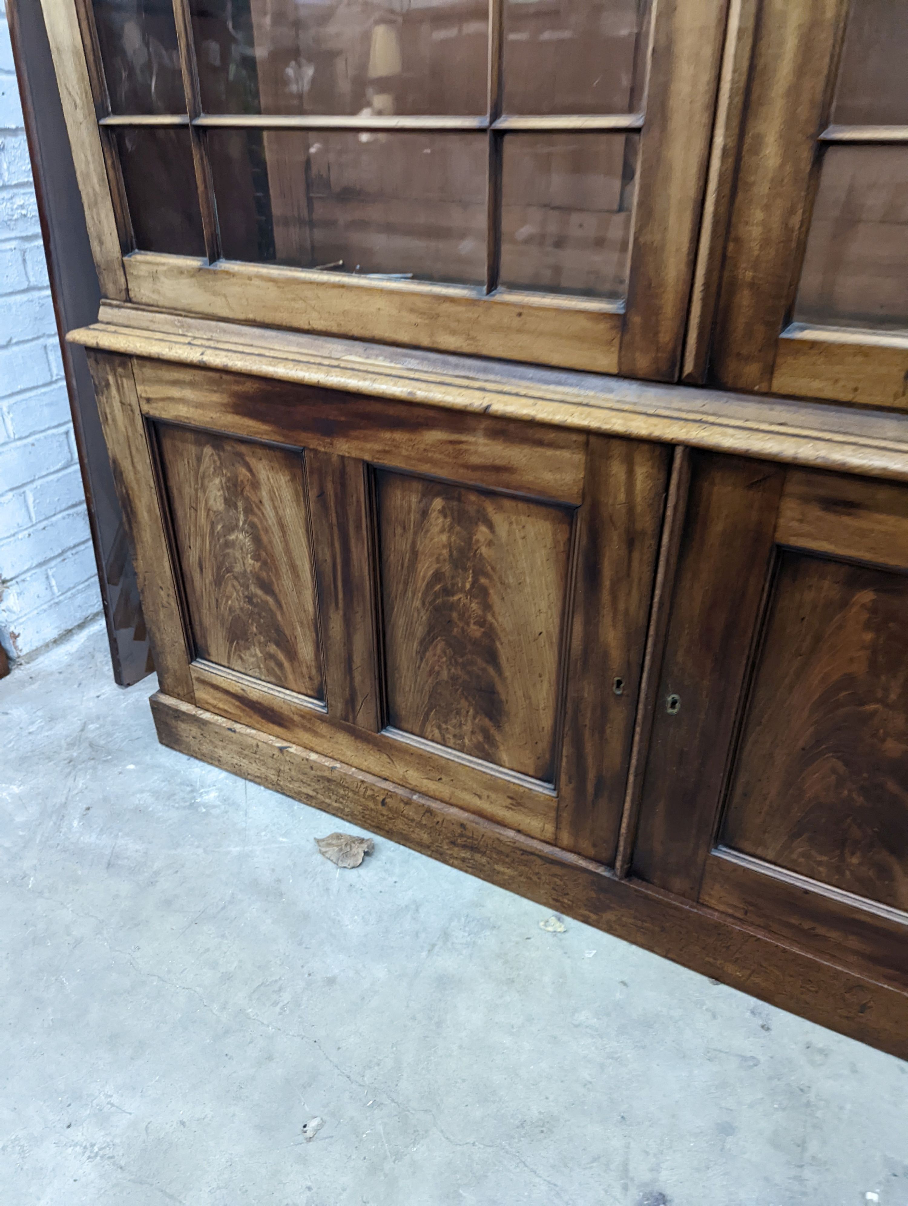 A George III style mahogany library bookcase, width 154cm, depth 38cm, height 217cm